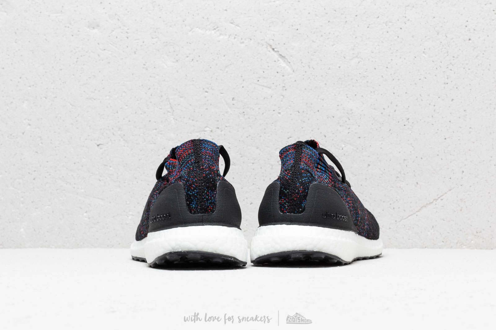 Adidas ultra boost uncaged core black active red blue top