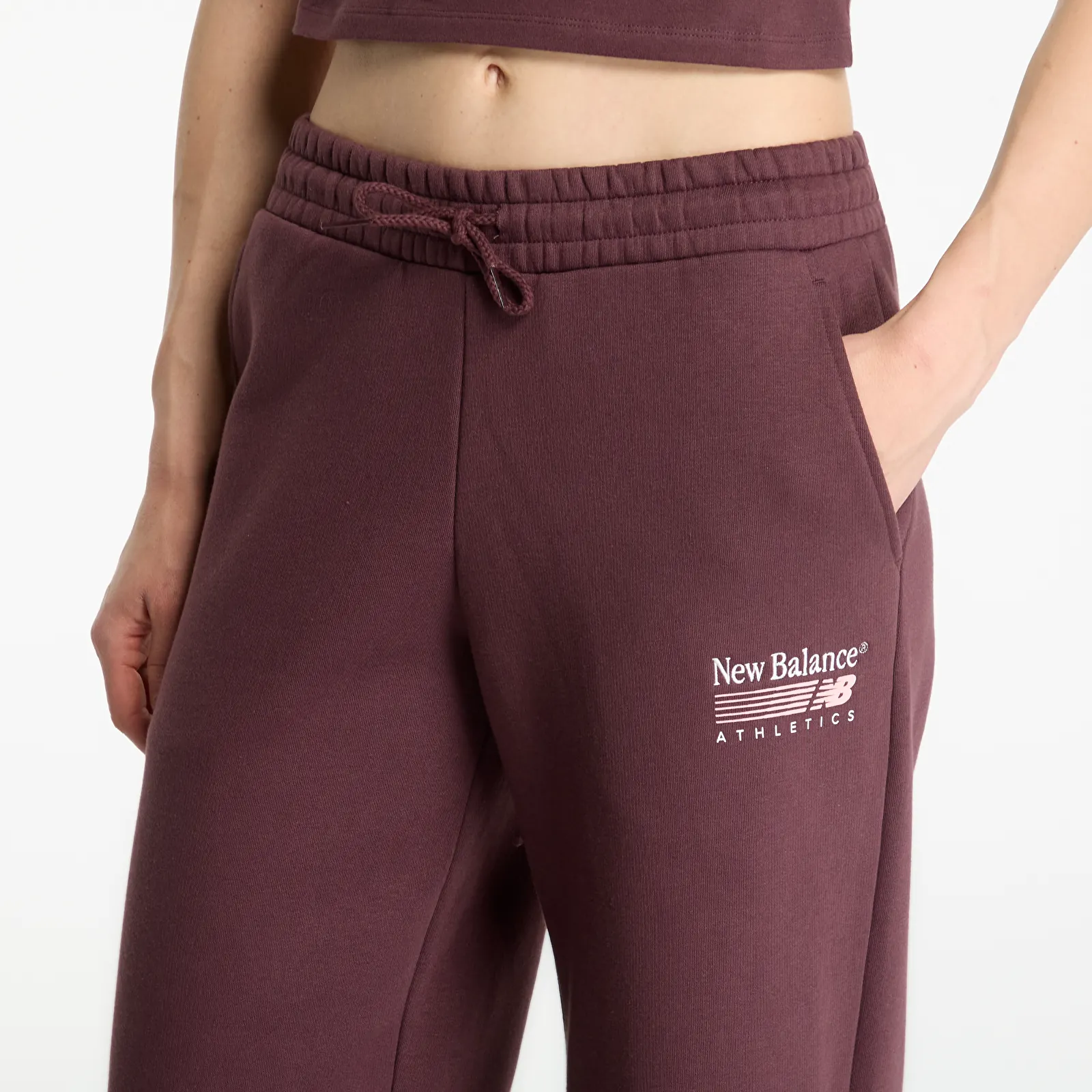 Tepláky New Balance Trackside Fleece Pant Cherry Leather
