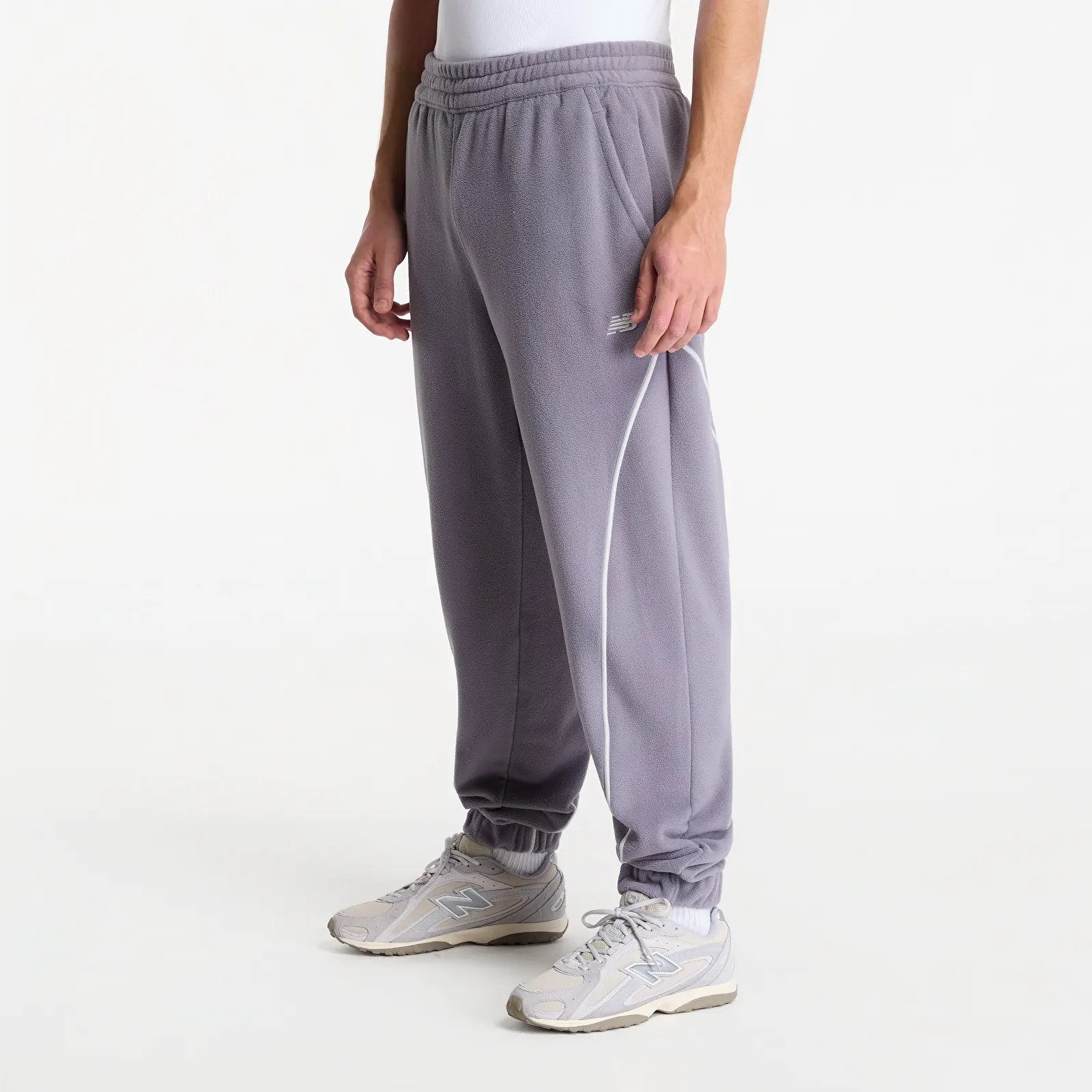 Joggingbukser New Balance Trackside Polar Fleece Jogger Off-Line Grey