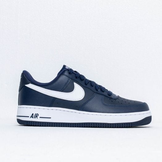 navy and white nike shoes