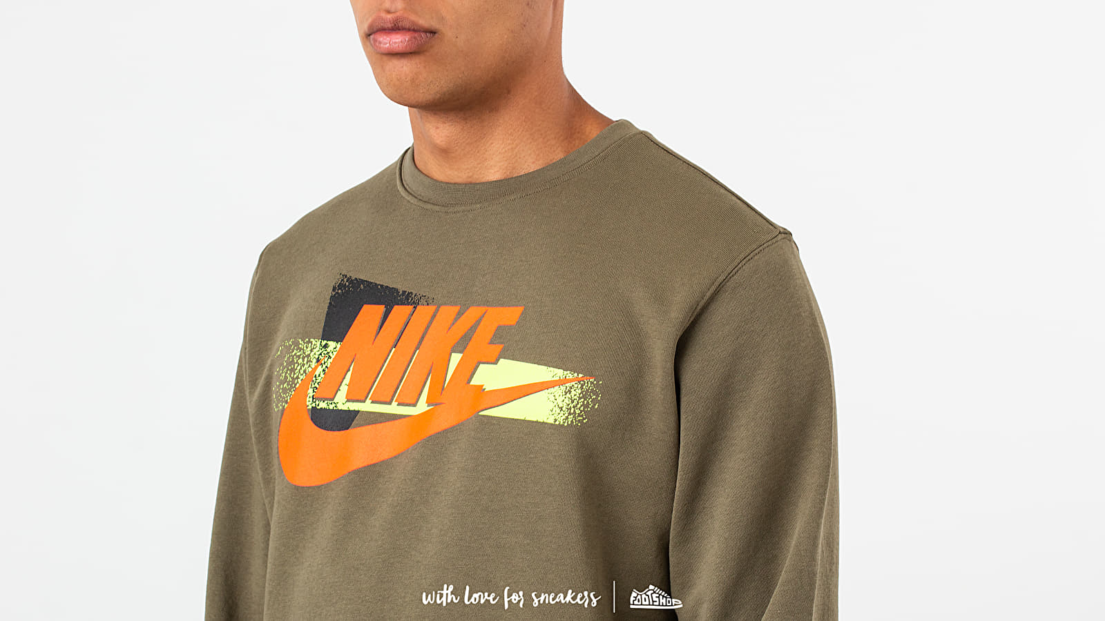 orange and olive green nike shirt