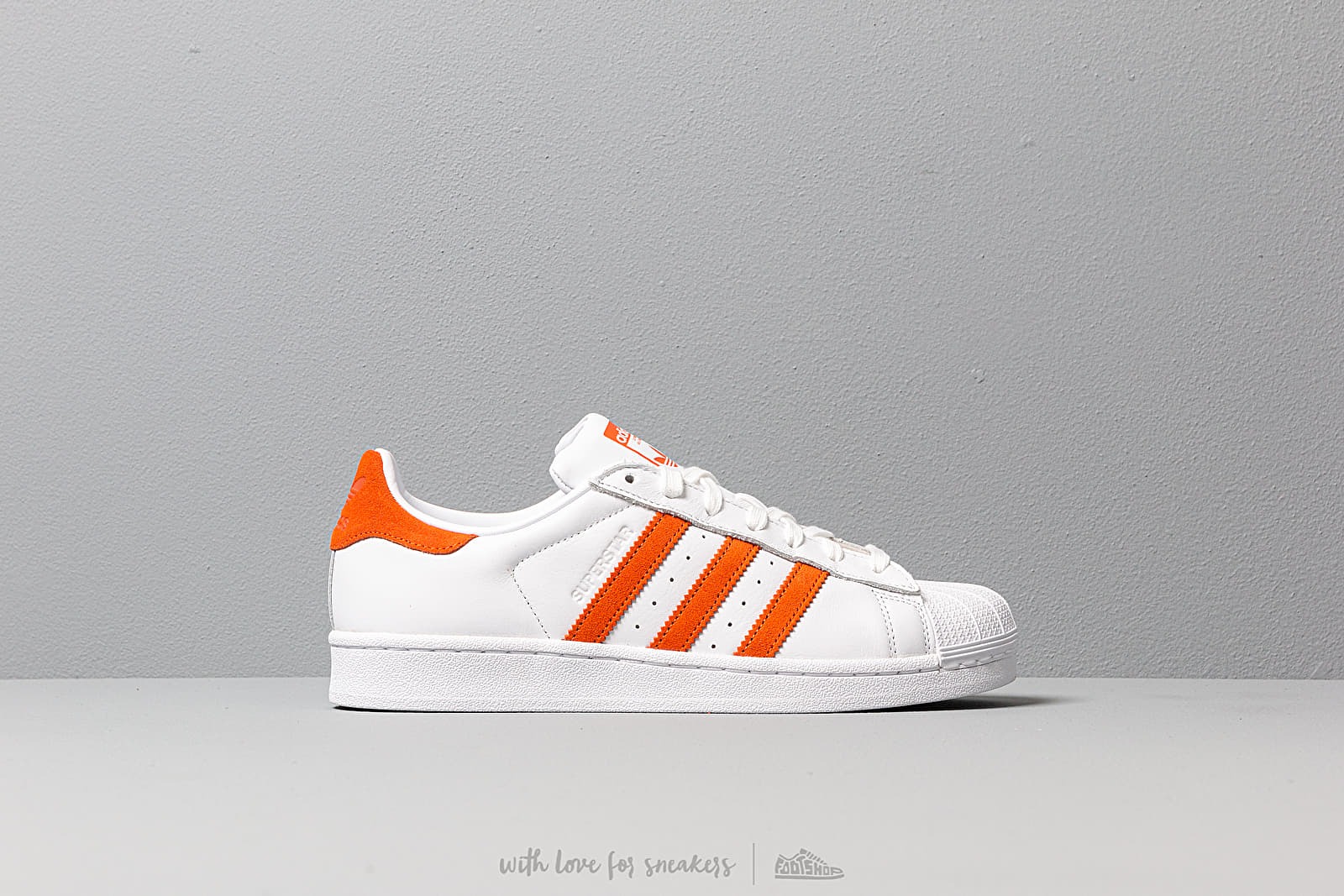 Adidas superstar white sales orange