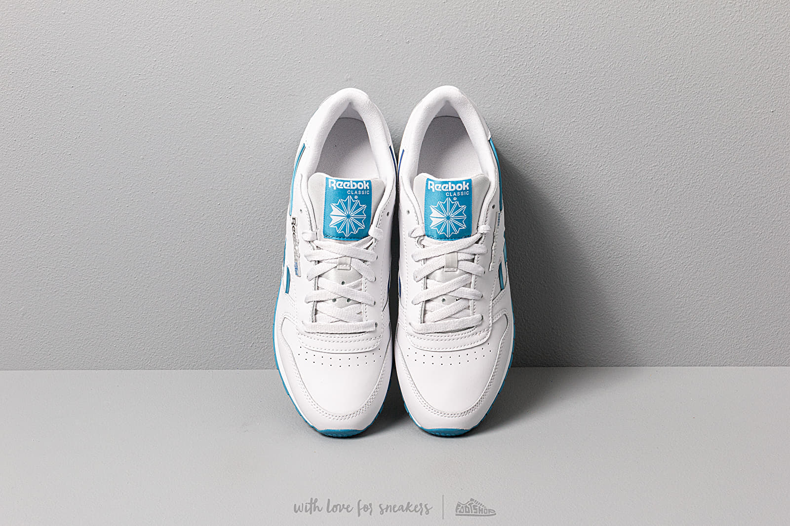 Polo reebok femme cyan on sale