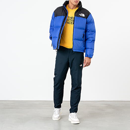 North face blue top and black jacket