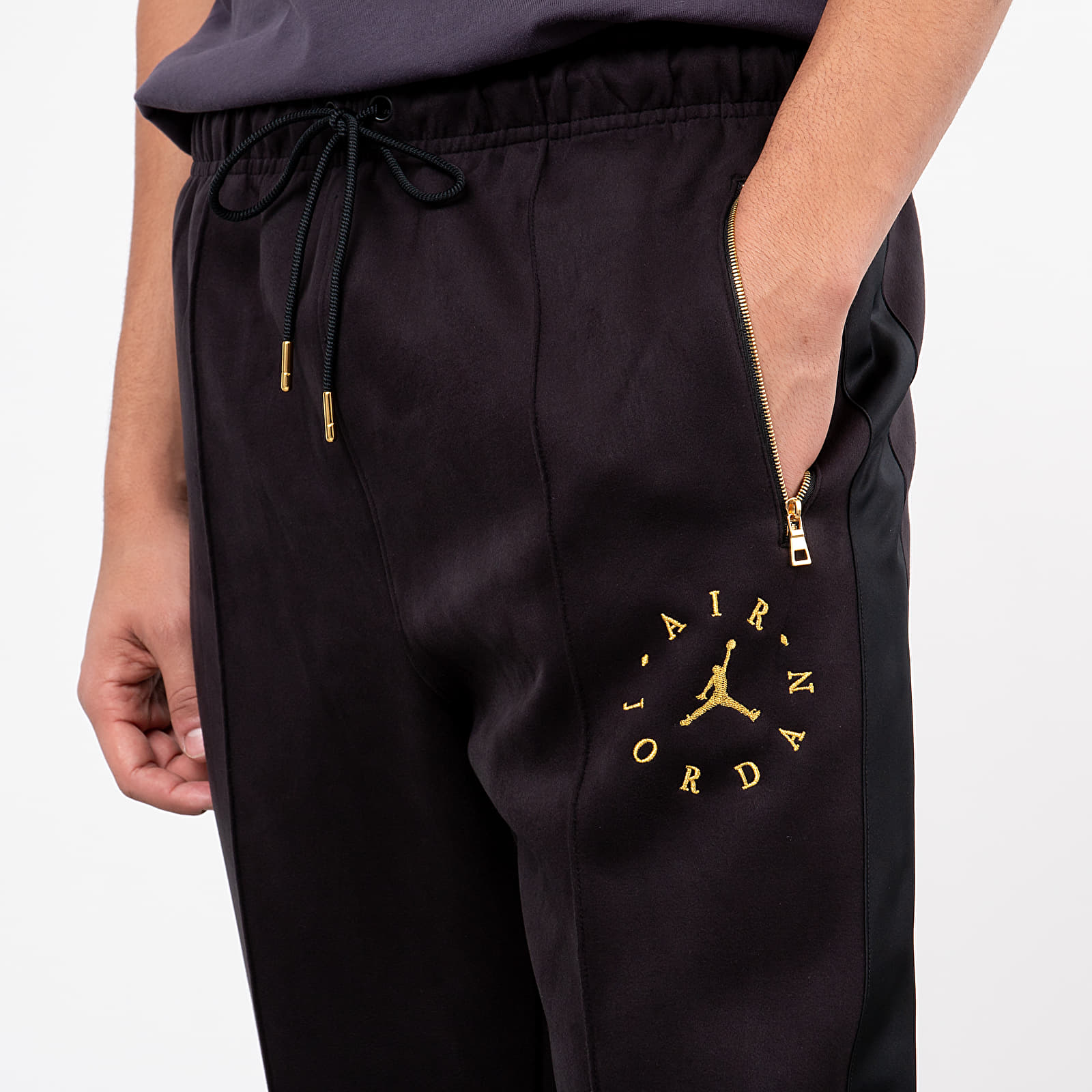 Black and gold jordan sweatpants top