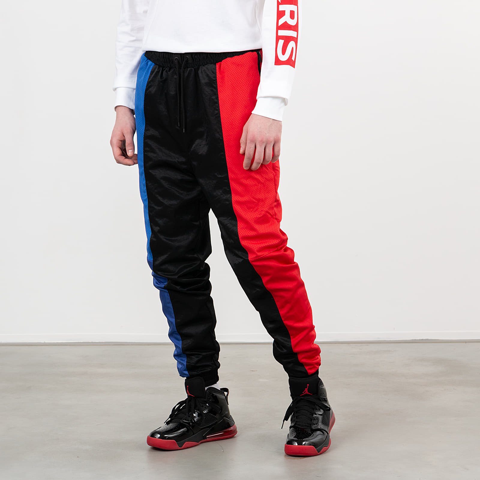 Nadrágok Jordan Paris Saint-Germain Air Jordan Suit Pants Black/ Game Royal/ University Red
