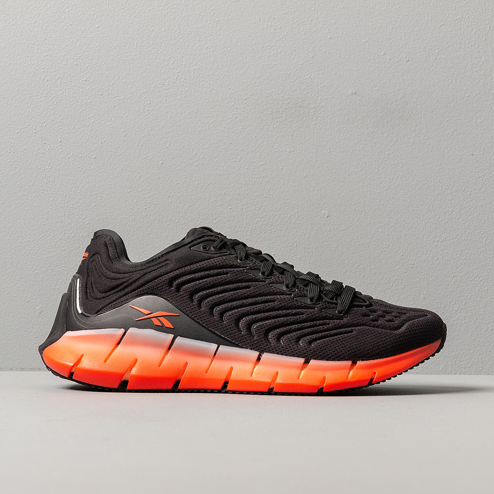 Reebok orange 2024 and black shoes