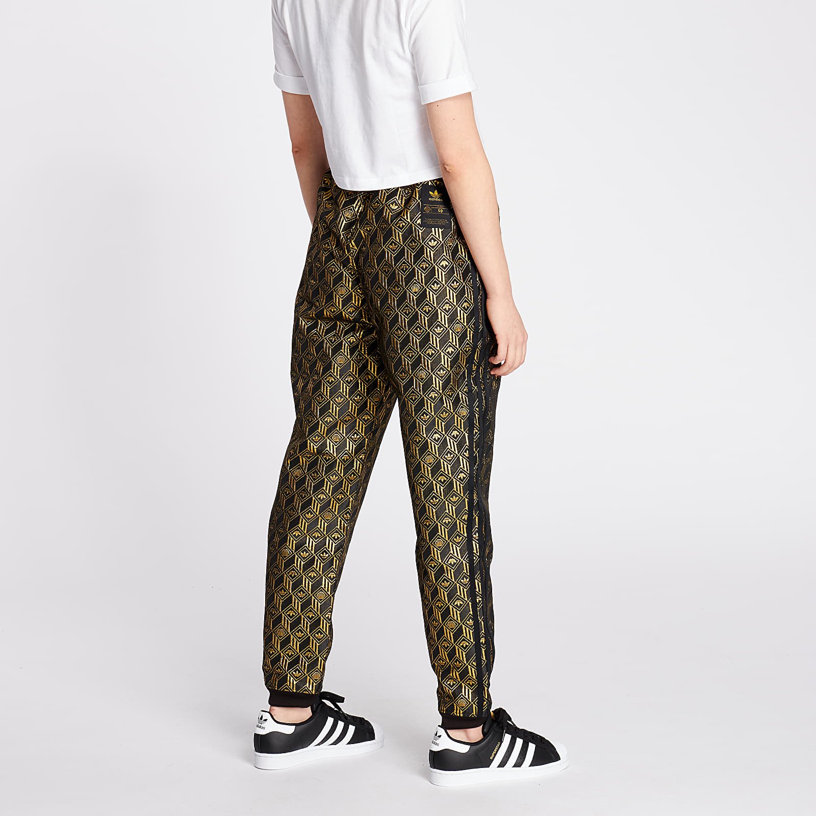 Adidas superstar track pants black gold on sale