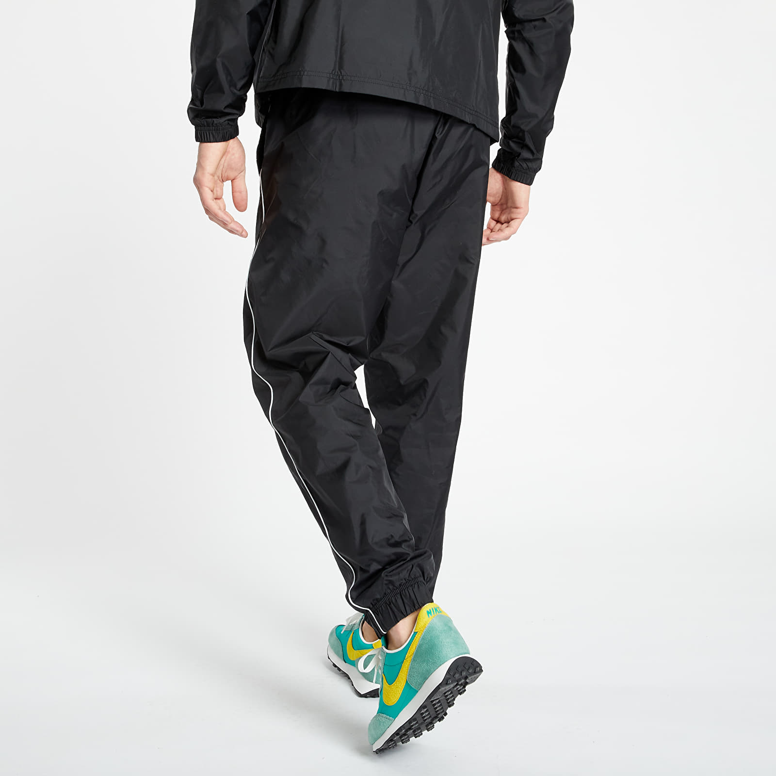 Nike woven tracksuit sale black and white