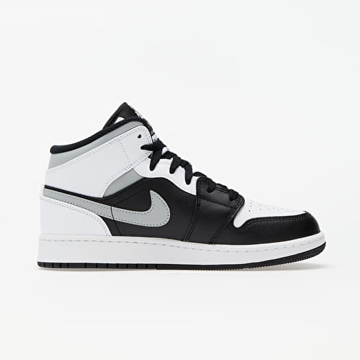 Kids black and white jordans discount