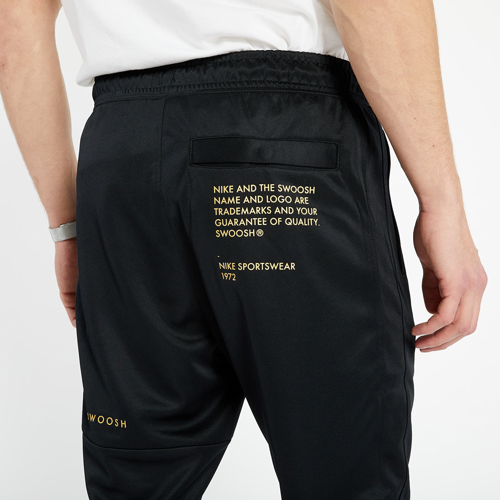 Black and gold nike pants hot sale