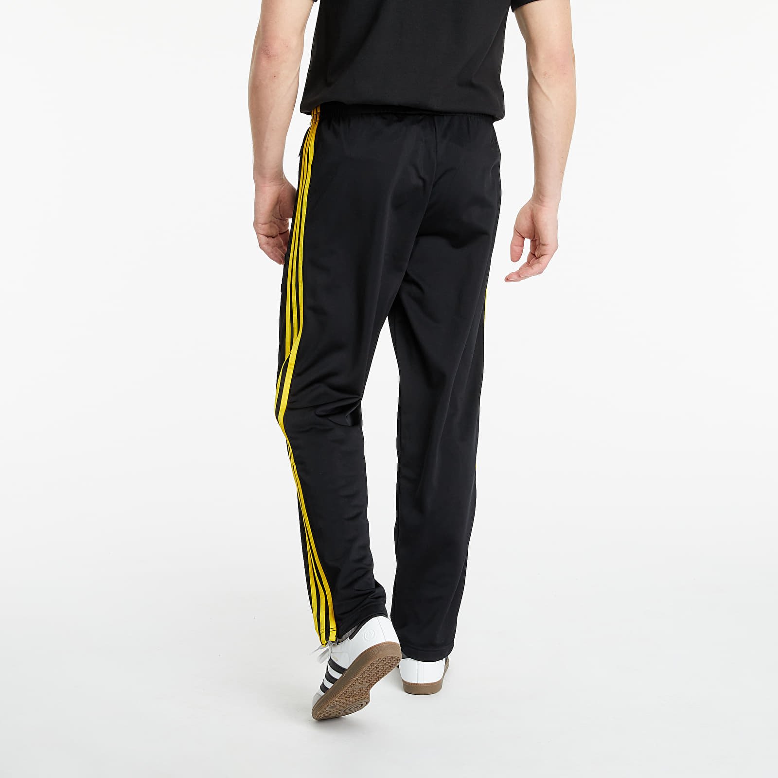 Black adidas pants with yellow stripes clearance