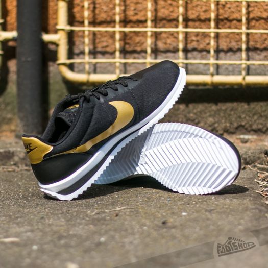 Nike cortez ultra black and gold best sale