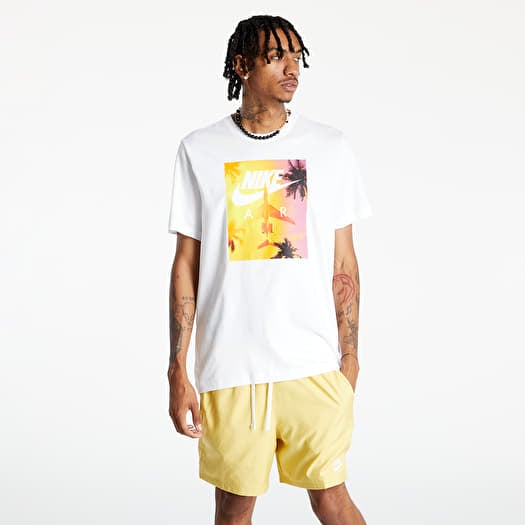 white nike shirt with orange swoosh