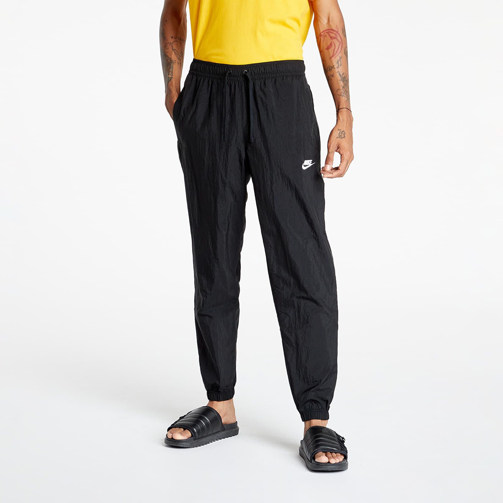 Pants and jeans Nike Sportswear Men s Core Track Pants Black Black White Footshop