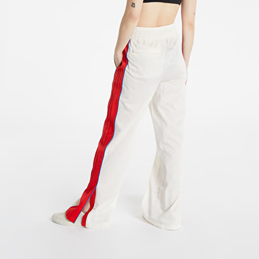White track pants with red best sale stripe