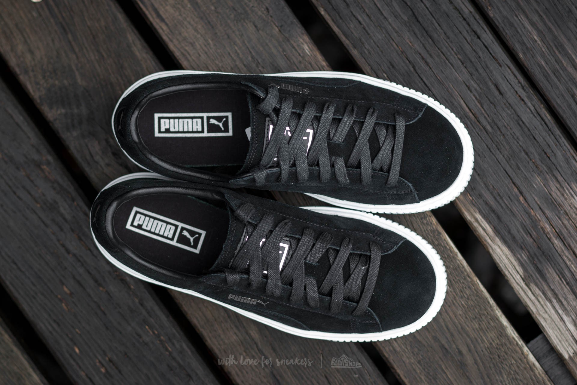Black and 2025 white platform pumas