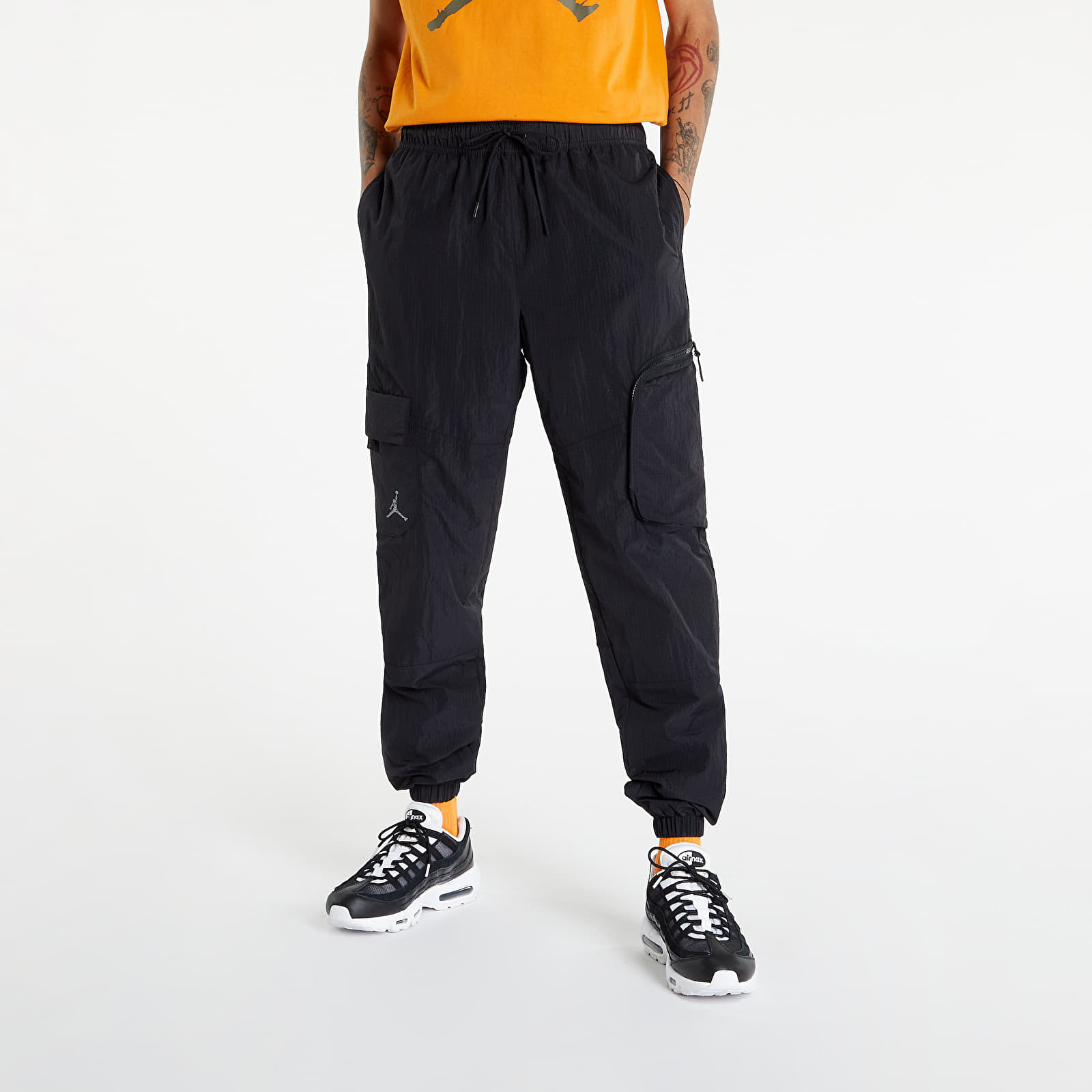 Džínsy a nohavice Jordan 23 Engineered Men's Track Pants Black/ Lt Fusion Red