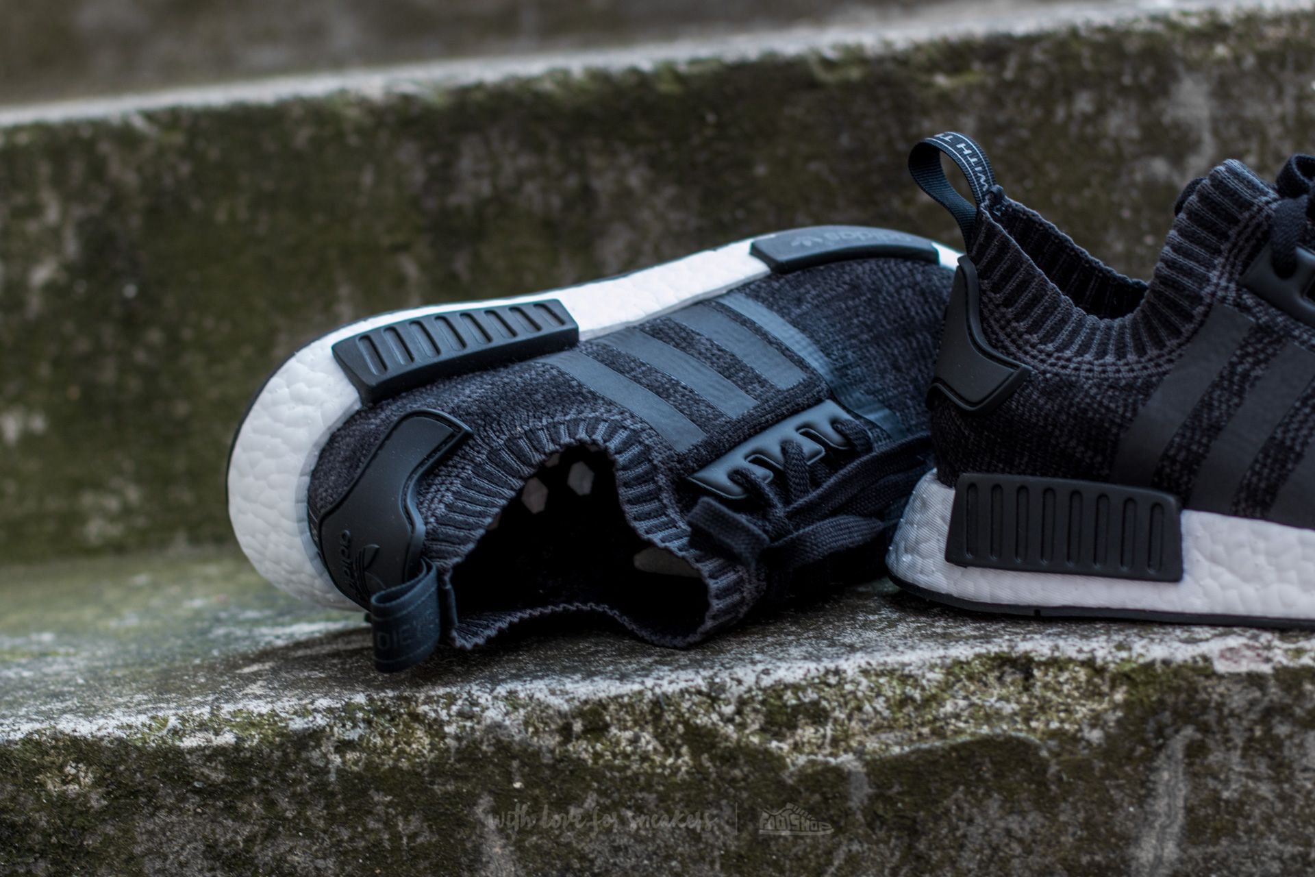 Adidas's nmd r1 primeknit core black and sesame top
