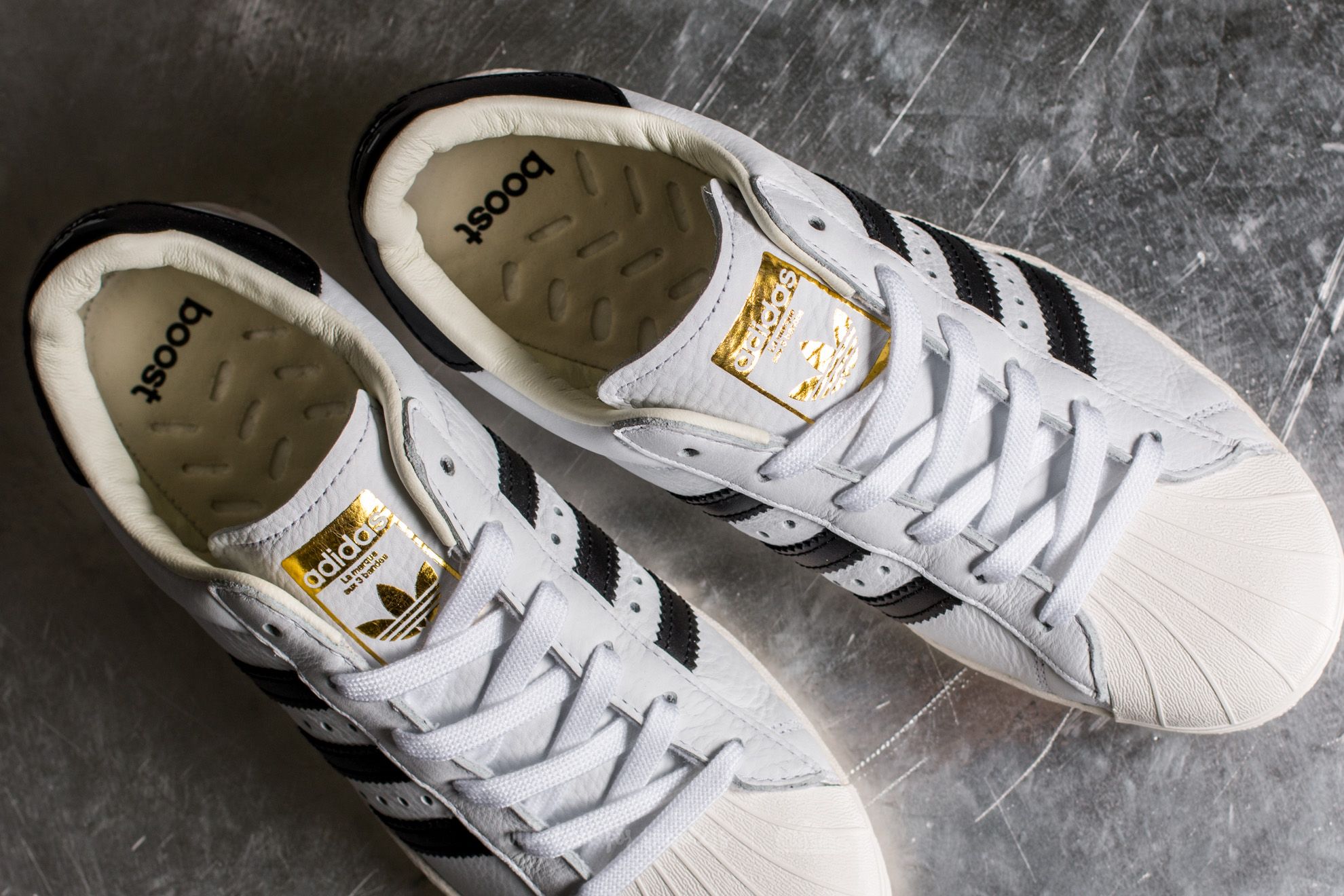 Adidas shoes black hotsell white and gold