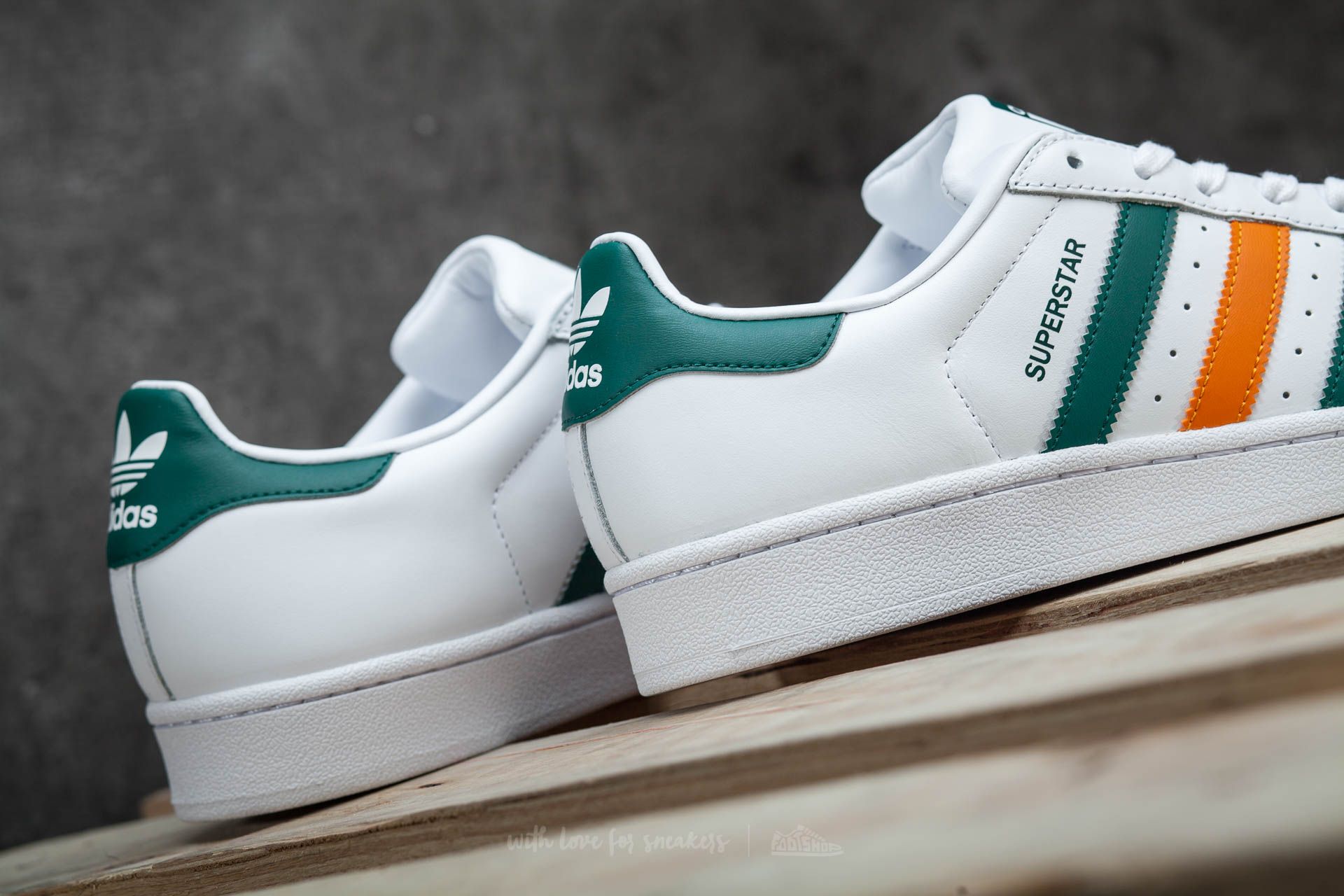 Adidas superstar green and orange stripes cheap