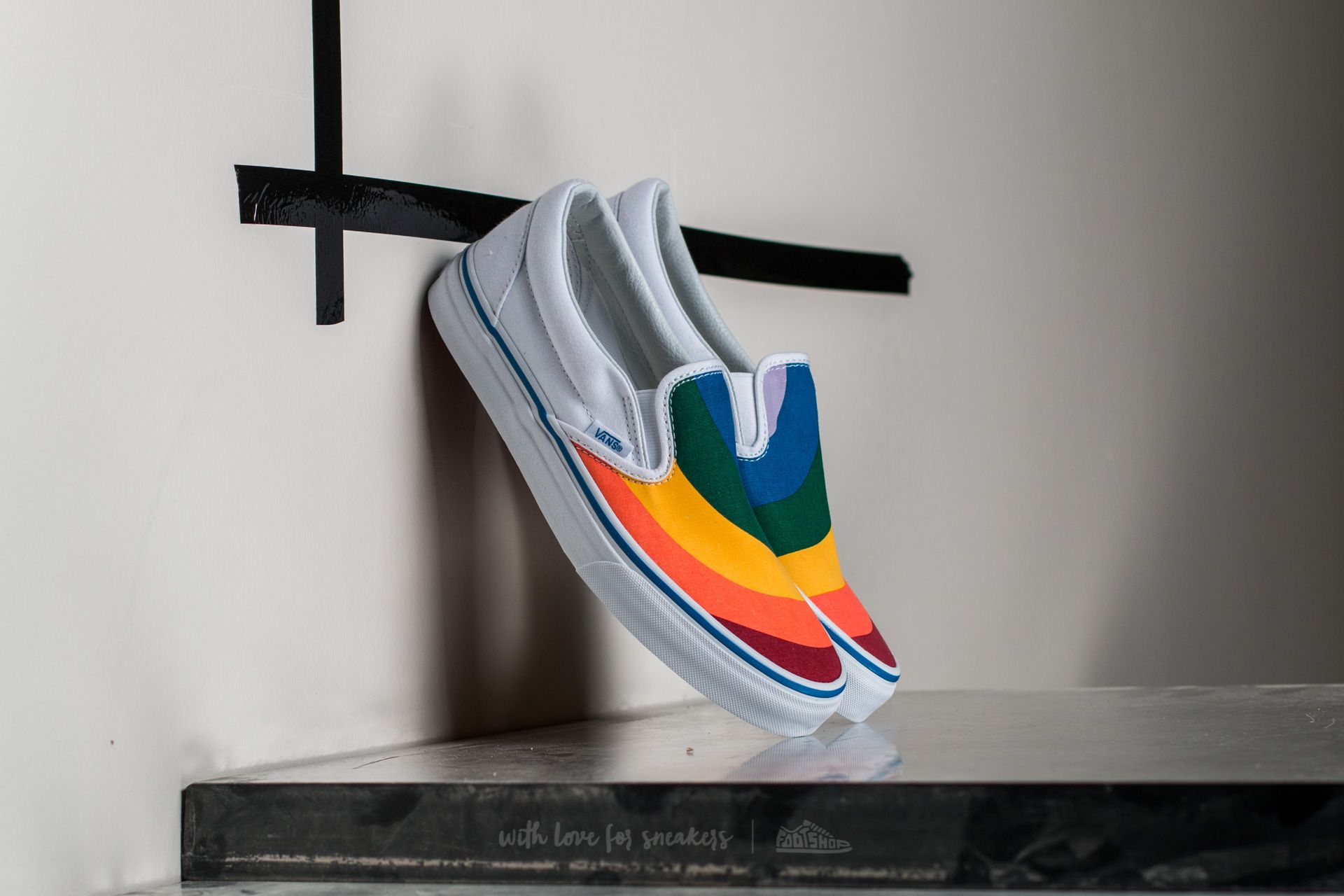 Rainbow white best sale slip on vans