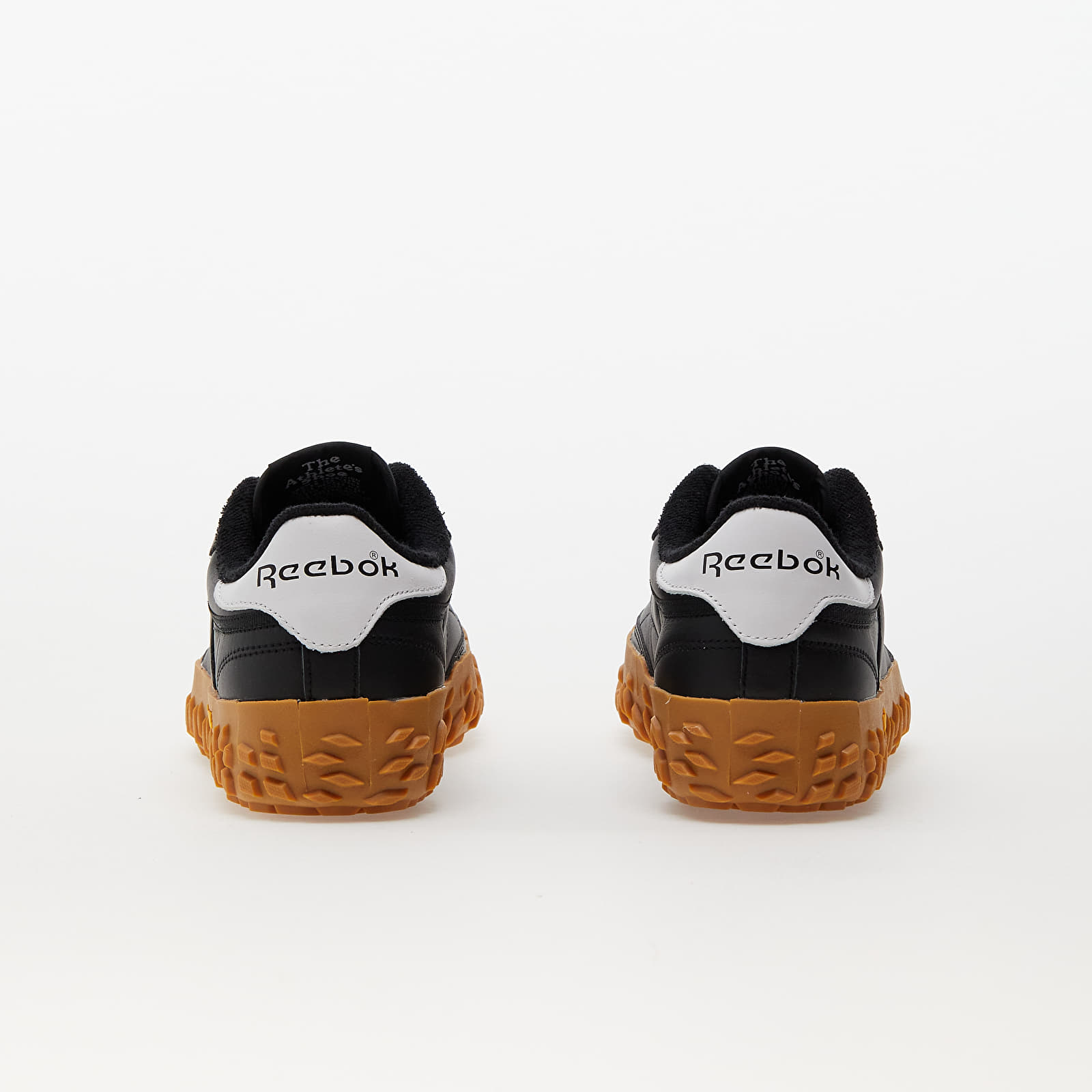 Black reebok deals with gum sole