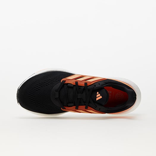 Adidas running shoes orange and black top