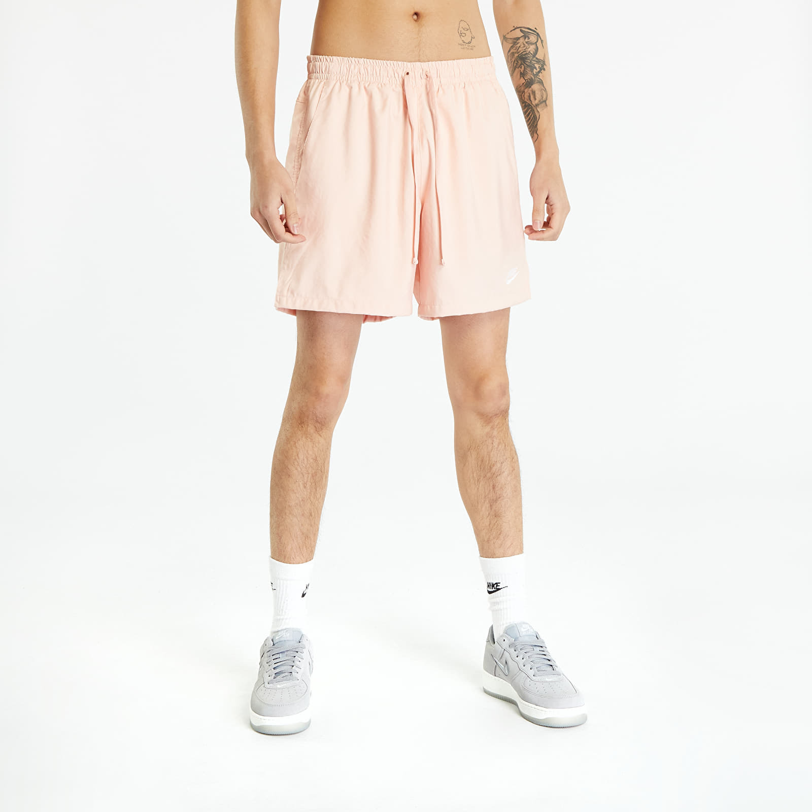 Nike - sportswear men's woven flow shorts arctic orange/ white