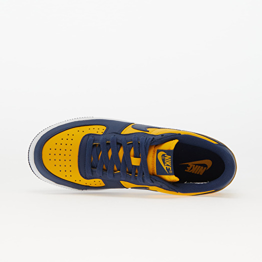 Nike navy and gold shoes top