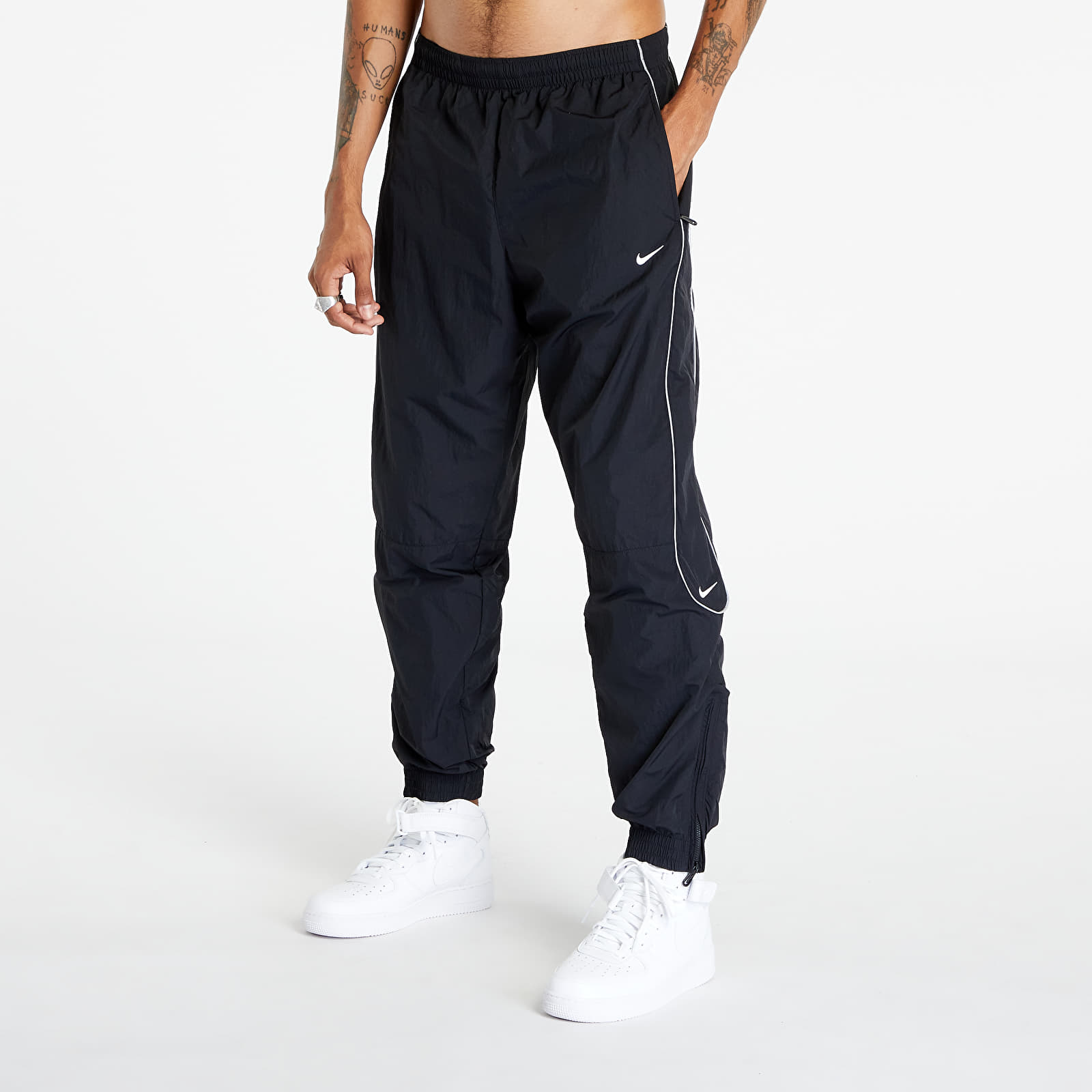 Šusťákové kalhoty Nike Solo Swoosh Men's Track Pant Black/ White